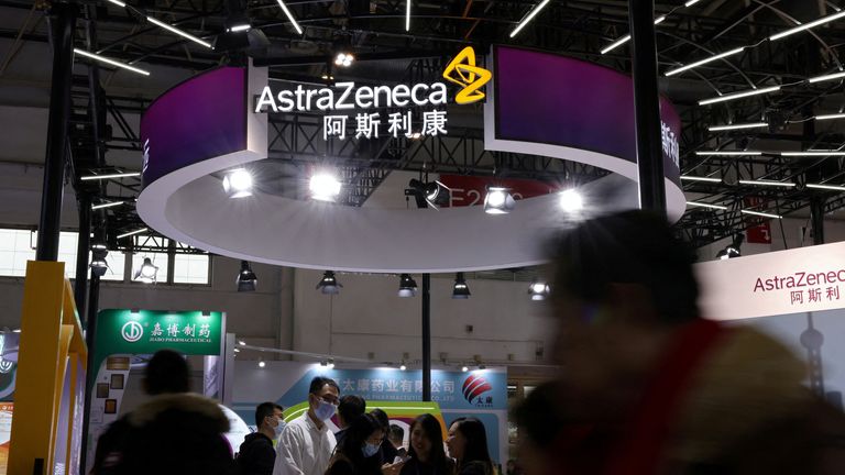 People walk past the AstraZeneca booth during the first China International Supply Chain Expo (CISCE) in Beijing. Pic: Reuters