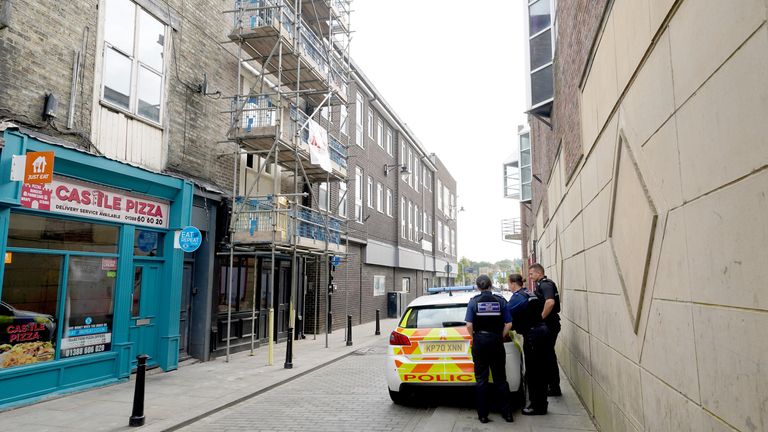 Police community support officers outside a disused building (left) in Fore Bondgate, Bishop Auckland.
Pic: PA