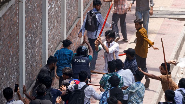 A police officer is surrounded during a clash between anti-quota supporters, police and Awami League supporters at the Rampura area in Dhaka, Bangladesh.
Pic: Reuters