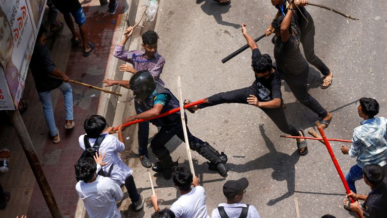 A police officer is surrounded during a clash between anti-quota supporters, police and Awami League supporters at the Rampura area in Dhaka, Bangladesh.
Pic: Reuters