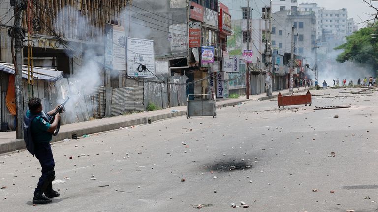 Police fire tear gas during clashes with students in Dhaka. Pic: Reuters