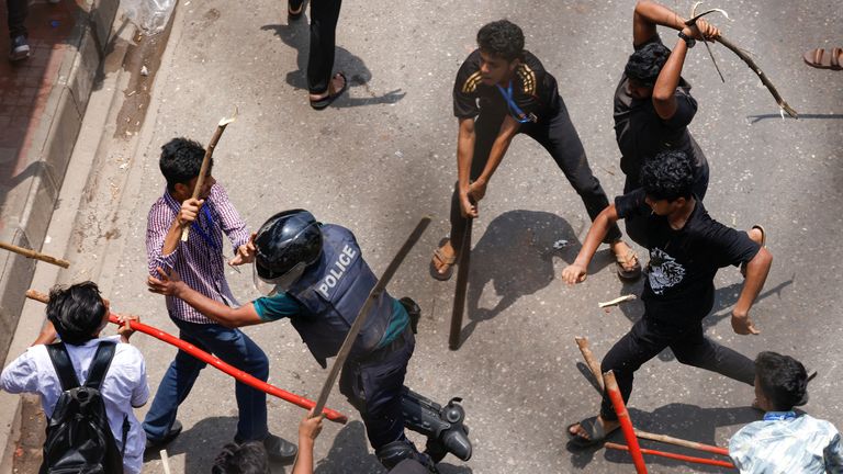 A police officer is surrounded during a clash between anti-quota supporters, police and Awami League supporters at the Rampura area in Dhaka, Bangladesh.
Pic: Reuters