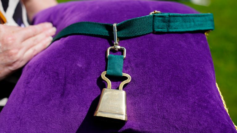 A bell presented to a goat during King Charles III and Queen Camilla's visit to Les Cotils at L'Hyvreuse