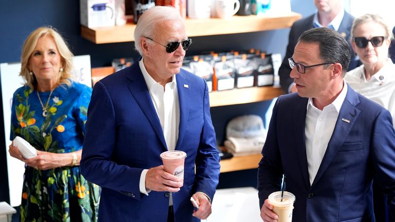 President Joe Biden, center, first lady Jill Biden, left, and Pennsylvania Gov. Josh Shapiro visit Denim Coffee after a campaign event in Harrisburg, Pa., on Sunday, July 7, 2024. (AP Photo/Manuel Balce Ceneta)