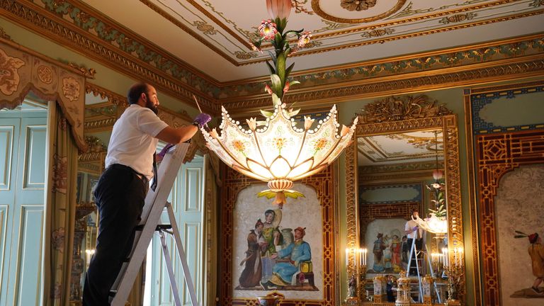 Final preparations are made in the Centre Room, where members of Royal Collection Trust staff tend to a chandelier, in the East Wing of Buckingham Palace, London, which is being opened to visitors for the first time this summer, when special guided tours of the Principal Floor will be available to visitors in July and August. Picture date: Monday July 8, 2024.