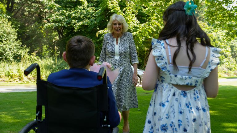 Pic: Buckingham Palace/PA Wire 
Handout photo issued by Buckingham Palace of Queen Camilla with Tony Hudgell, from West Malling in Kent, and Lyla O'Donovan from Catterick, during a private tea party in the gardens Summer House at Buckingham Palace, London, on Wednesday June 26, hosted by the queen. Issue date: Monday July 1, 2024. PA Photo. Photo credit should read: Buckingham Palace/PA Wire 