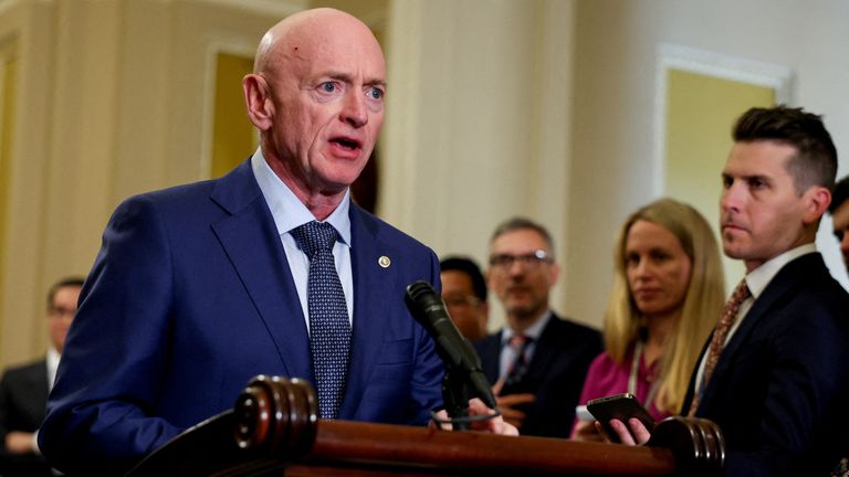 Mark Kelly looks at reporters during a press conference following the weekly Senate caucus luncheons on Capitol Hill.
Pic: Reuters