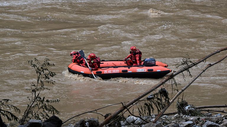 Rescuers search for survivors after the bridge collapse in Shaanxi Province on Saturday. Pic: AP