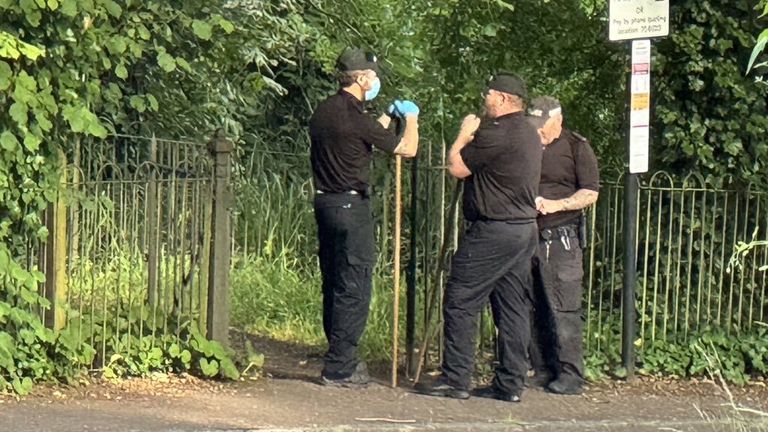 Police searching woodland area near the bridge this evening