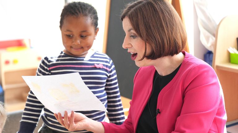 Education Secretary Bridget Phillipson is shown a painting by pupil Aicha, aged 4, whilst taking part in an art activity during a visit to the school-based nursery at Ark Start Oval, East Croydon, in south London. Picture date: Wednesday July 10, 2024. PA Photo. Photo credit should read: Yui Mok/PA Wire