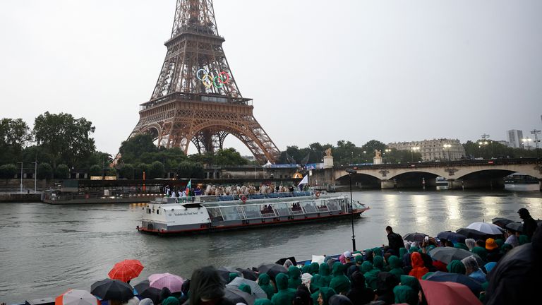 Team Cyprus, Team Colombia and Team Comoros passes in front of the Eiffel Tower.
Pic: Reuters