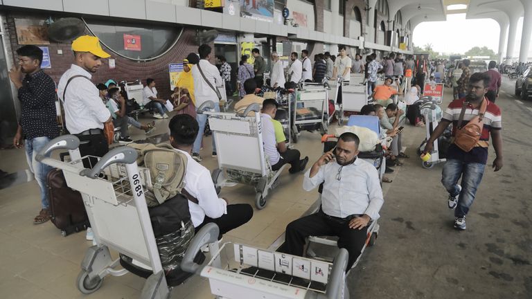 Passengers wait at Hazrat Shahjalal International Airport's Departure Terminal days ahead of their scheduled flight due to ongoing curfew in Dhaka.
Pic: AP