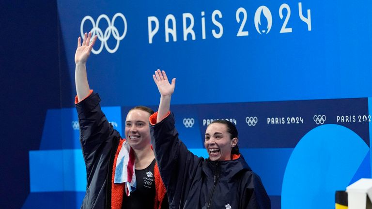 Britain's Yasmin Harper and Scarlett Mew Jensen celebrates after winning the bronze medal in the women's synchronised 3m springboard diving final at the 2024 Summer Olympics, Saturday, July 27, 2024, in Saint-Denis, France. (AP Photo/Lee Jin-man)