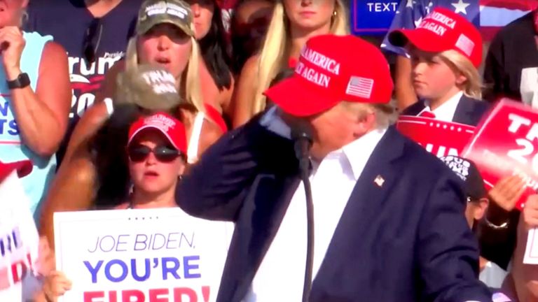 Donald Trump reacts after gunshots were heard during a campaign rally at the Butler Farm Show in Butler, Pennsylvania.  Photo: Reuters