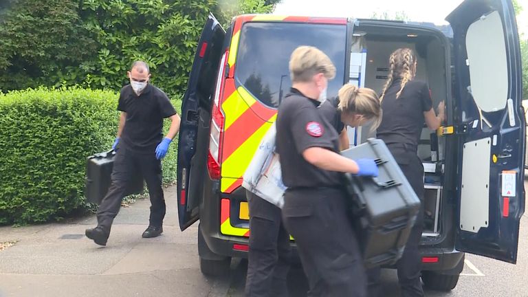 Police staff outside the property in Enfield today