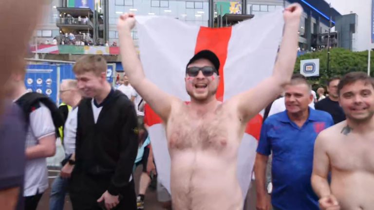England fans celebrate after the team beat Slovakia 2-1 in extra-time.
