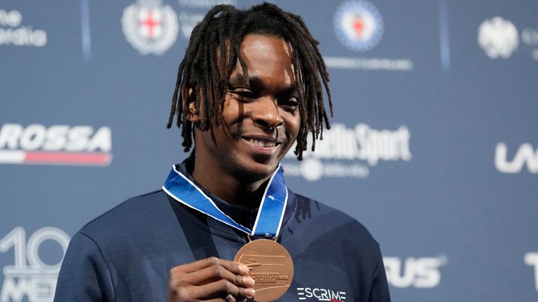 Enzo Lefort holds his bronze medal on the podium of the men's Individual Foil final at the Fencing World Championships in Milan last year. Pic: AP