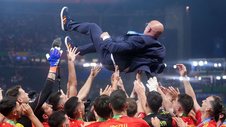 Spain manager Luis de la Fuente is thrown in the air by players. Pic: PA
