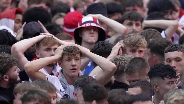 England fans at Millennium Square in Leeds react after their team concedes a goal. Pic: PA