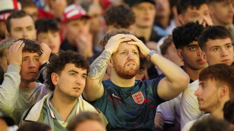 England fans at Millennium Square in Leeds react after their team conceded a second goal. Pic: PA