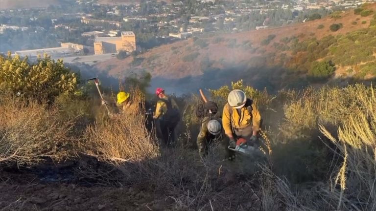 Crews work to contain fire in Southern California amid heat wave