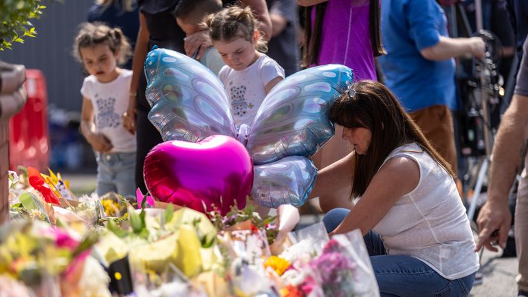 People lay flowers near the scene of the attack. Pic: PA