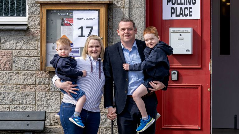 Scottish Conservative leader Douglas Ross arrives with his family to cast his vote in the 2024 General Election at Fogwatt Hall, Longmorn, Elgin.
Pic:PA