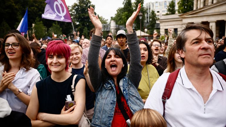 Supporters of French far-left opposition party La France Insoumise (France Unbowed - LFI) gather at Place Stalingrad before partial results in the second round of the early French parliamentary elections in Paris, France, July 7, 2024. REUTERS/Yara Nardi