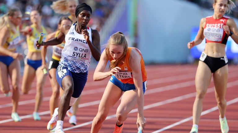 Athletics - World Athletics Championships - Women's 4x400 Metres Relay - Heats - Hayward Field, Eugene, Oregon, U.S. - July 23, 2022 Netherlands' Cathelijn Peeters and France's Sounkamba Sylla in action during their heat REUTERS/Lucy Nicholson