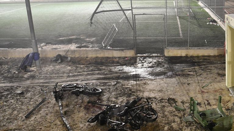 The scene after rockets hit a football pitch. Pic: Reuters