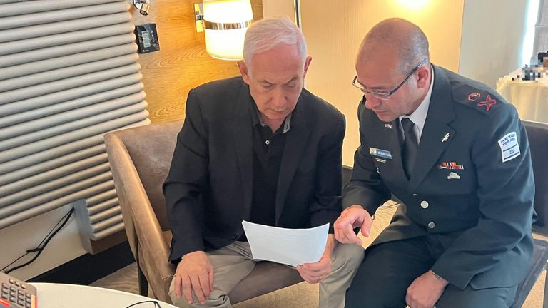 Israeli Prime Minister Benjamin Netanyahu consults his military secretary, Major-General Roman Gofman. Pic: GPO