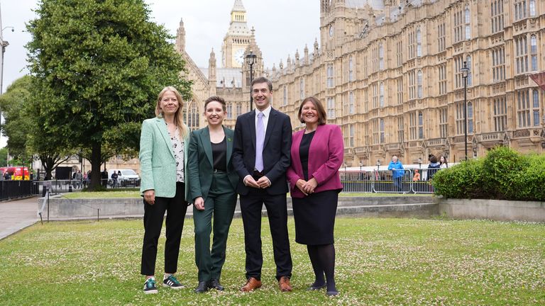 The four new Green MPs who won seats in the 2024 General Election, (left to right) Sian Berry (MP for Brighton Pavilion), party co-leader Carla Denyer (MP for Bristol Central), party co-leader Adrian Ramsay (MP for Waveney Valley) and Ellie Chowns (MP for North Herefordshire) pose for photos on College Green opposite the Palace of Westminster, London. Picture date: Monday July 8, 2024. PA Photo. See PA story POLITICS Green. Photo credit should read: Ian West/PA Wire