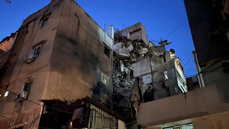 A general view shows a damaged building that was hit by an Israeli airstrike in the southern suburbs of Beirut, Lebanon, Tuesday, July 30, 2024. An Israeli airstrike hit Hezbollah's stronghold south of Beirut Tuesday evening causing damage, a Hezbollah official and the group's TV station said. (AP Photo/Hussein Malla)