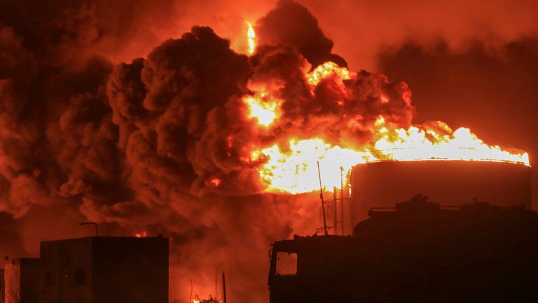 Oil tanks burn in the port city of Hodeidah. Pic: AP