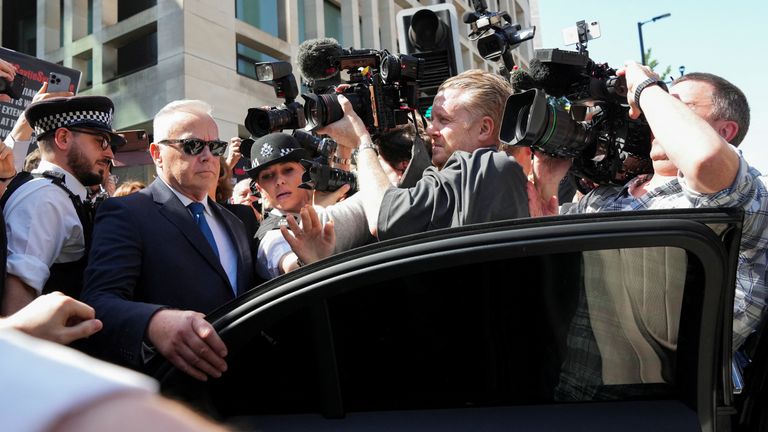 Huw Edwards gets into a car outside Westminster Magistrates' Court.
Pic: Reuters