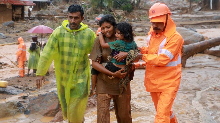 Rescuers help residents to move to a safer place, at a landslide site after multiple landslides in the hills, in Wayanad, in the southern state of Kerala, India, July 30, 2024. REUTERS/Stringer TPX IMAGES OF THE DAY
