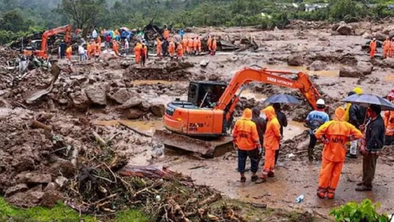 This photograph provided by National Disaster Response Force (NDRF) shows rescuers at a spot after a landslide in Wayanad, southern Kerala state, India, Tuesday, July 30, 2024. (NDRF via AP)


