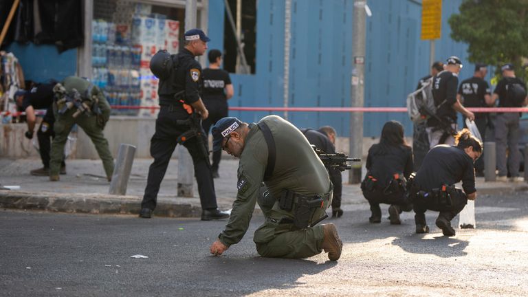 Israeli police investigate the scene of the drone attack. Pic: AP