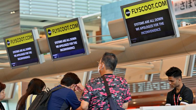 Passengers manually checking in at Terminal 1 at Changi Airport in Singapore.  Photo: Reuters