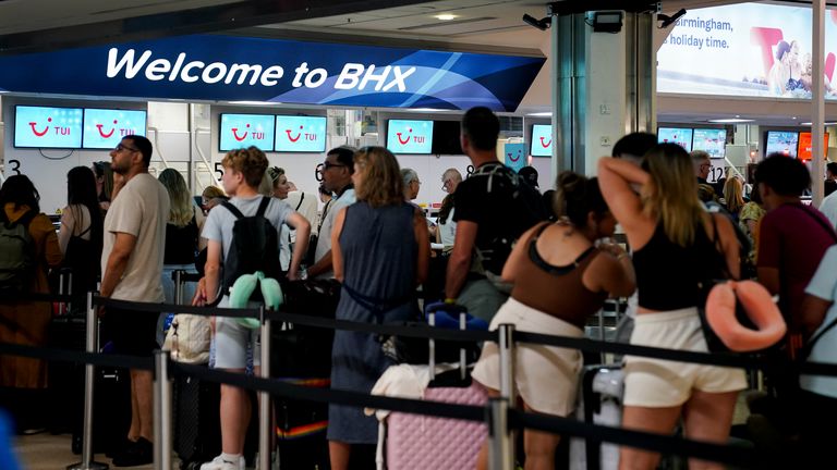 Passengers queue at Birmingham Airport as a result of the IT failure. Pic: Jacob King/PA