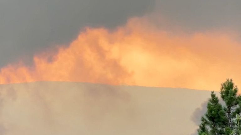 Smoke rises from a wildfire burning in Jasper, Alberta, Canada. Pic: Joe Oliver via Reuters