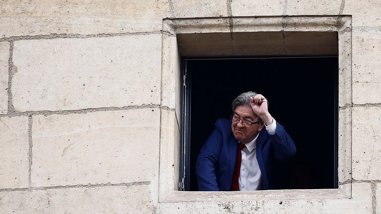 Jean-Luc Melenchon, leader of French far-left opposition party La France Insoumise (France Unbowed - LFI), and member of the alliance of left-wing parties, called the Nouveau Front Populaire (New Popular Front - NFP), gestures after partial results in the second round of the early French parliamentary elections, at Place Stalingrad in Paris, France, July 7, 2024. REUTERS/Yara Nardi