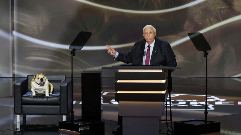 West Virginia Governor Jim Justice on stage in Milwaukee with his dog. Pic: Reuters