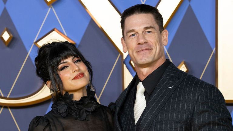 Shay Shariatzadeh, left, and John Cena pose for photographers upon arrival at the World premiere of the film 'Argylle' on Wednesday, Jan. 24, 2024 in London. (Scott A Garfitt/Invision/AP)