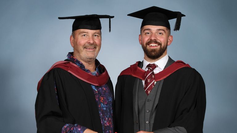 Jonny Clothier and his son Carter on their graduation day. Pic: PA