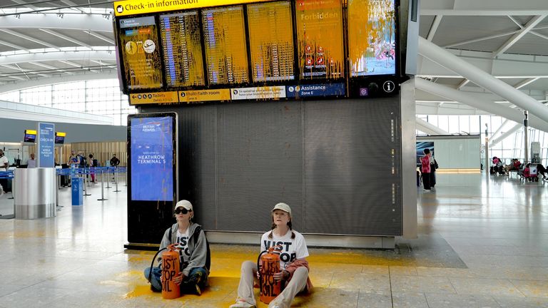 The two women were later arrested and taken away. Pic: Just Stop Oil