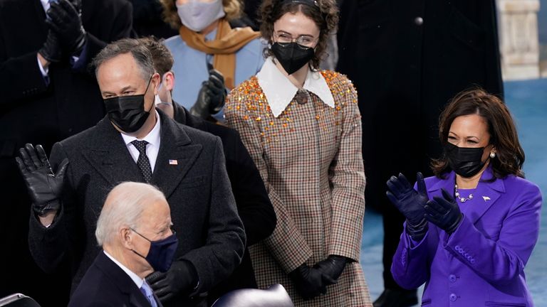 Kamala Harris, Ella Emhoff and Doug Emhoff watch as Joe Biden is inaugurated President. Pic: AP