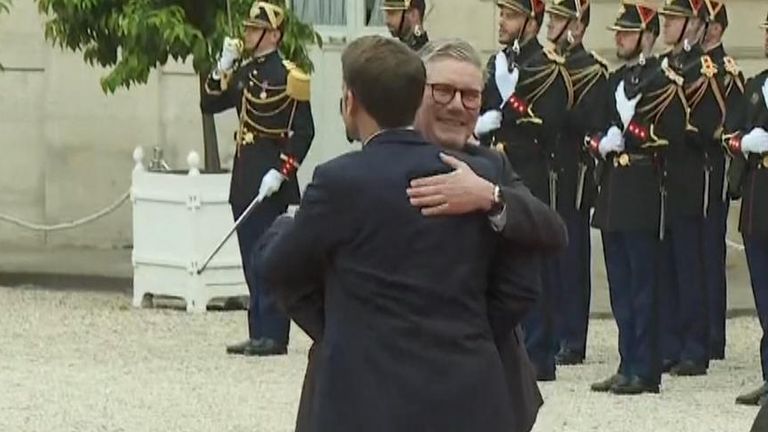 Sir Keir Starmer has hugged president Macron ahead of the Olympic Games opening ceremony.