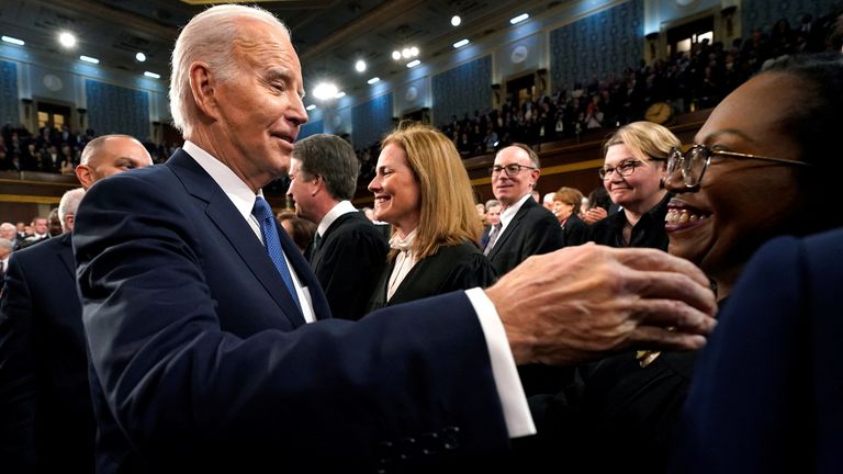 President Joe Biden greets Supreme Court Justice Ketanji Brown Jackson. Pic: Reuters