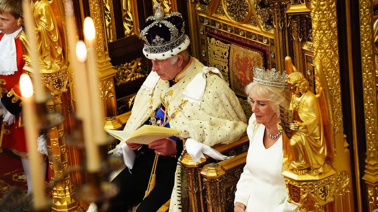 King Charles III, wearing the Imperial State Crown and the Robe of State, reads the King's Speech, beside Queen Camilla, wearing the George IV State Diadem and the Robe of State, during the State Opening of Parliament in chamber of the House of Lords at the Palace of Westminster, London. Picture date: Wednesday July 17, 2024. PA Photo. See PA story POLITICS Speech. Photo credit should read: Aaron Chown/PA Wire